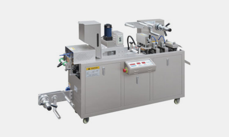 Flat plate blister packaging machine