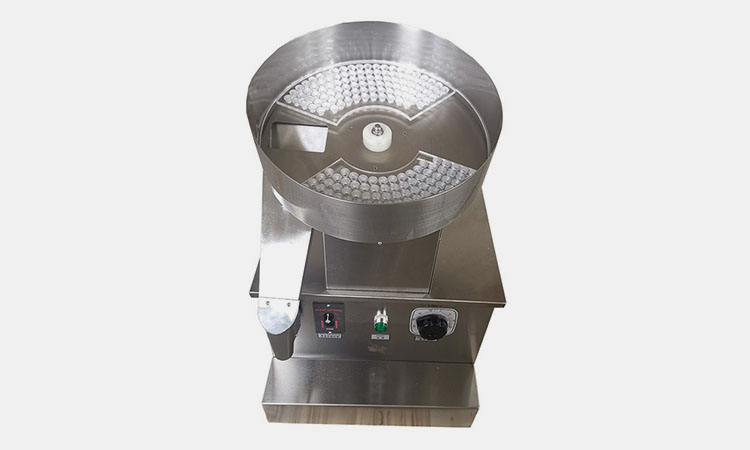 Rotary capsule bottle filling machine