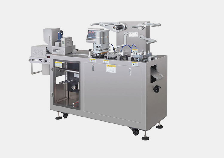 Heat sealing tablet blister packaging machine